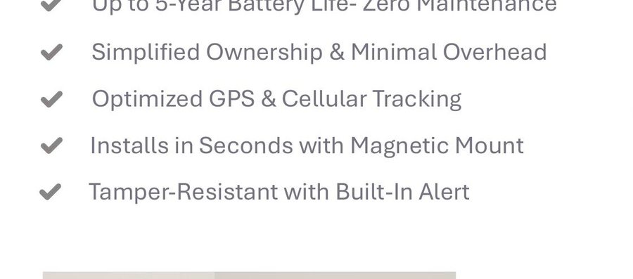 Safelink GForce GPS tracking device shown in hand for scale